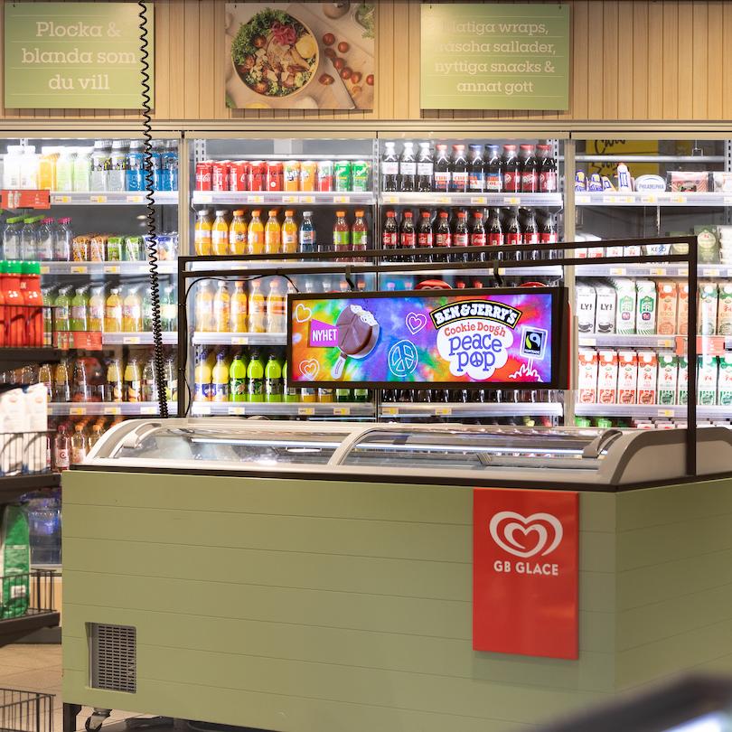 Digital screen on an ice cream freezer in a service station shop